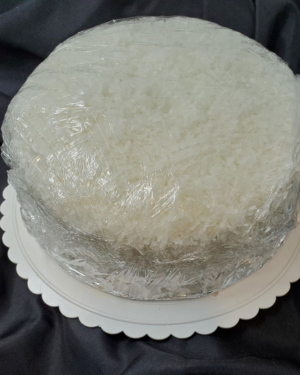 A coconut cake is a light & airy cake with flaky coconut creme icing.