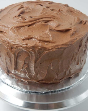 A chocolate cake is a rich velvety chocolate cake paired with a smooth chocolate icing.